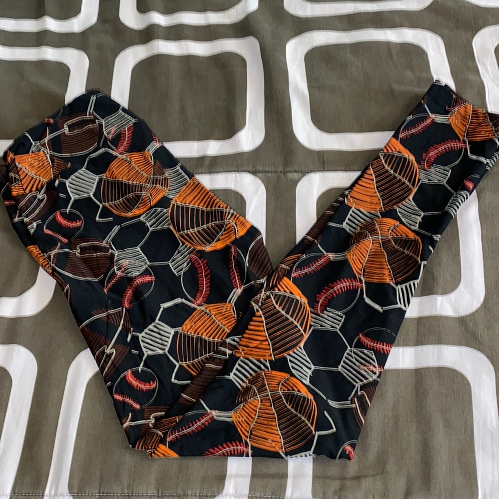 LuLaRoe Black Leggings with sports theme basketball,soccer and baseball